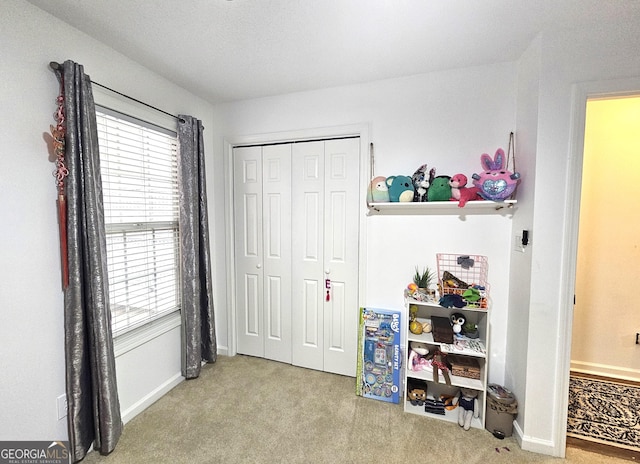 carpeted bedroom featuring a closet