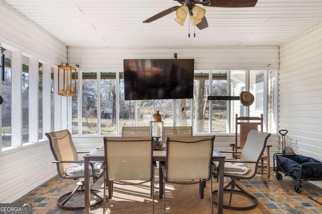 sunroom featuring ceiling fan