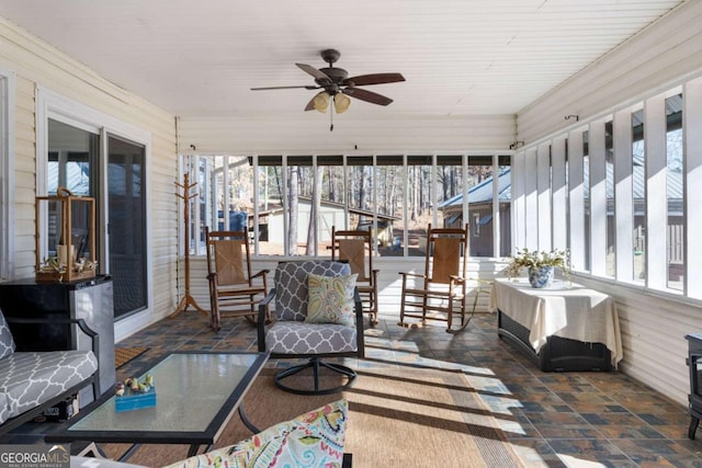 sunroom with ceiling fan and a wealth of natural light