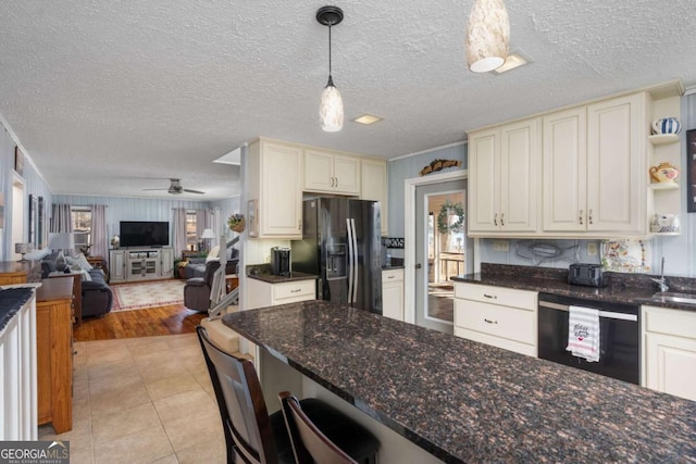 kitchen featuring light tile patterned floors, refrigerator with ice dispenser, ceiling fan, decorative light fixtures, and dishwasher