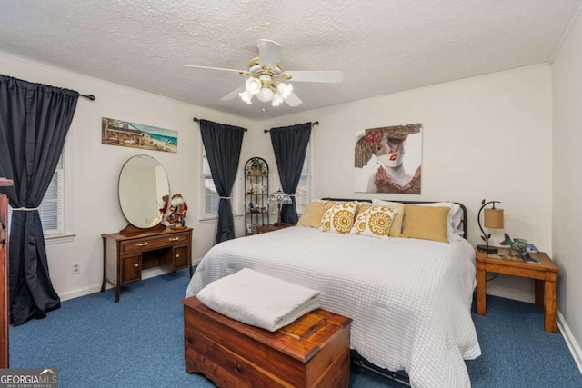 carpeted bedroom with ceiling fan and a textured ceiling