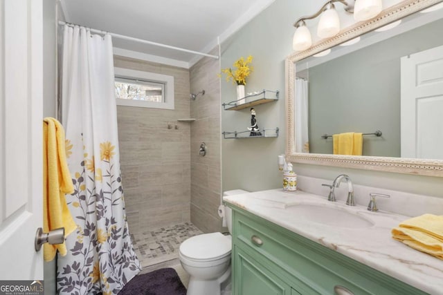 bathroom with toilet, vanity, and a shower with curtain