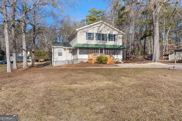 view of front of house with a front lawn and a porch