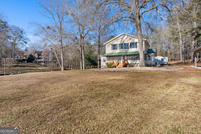 view of yard with covered porch