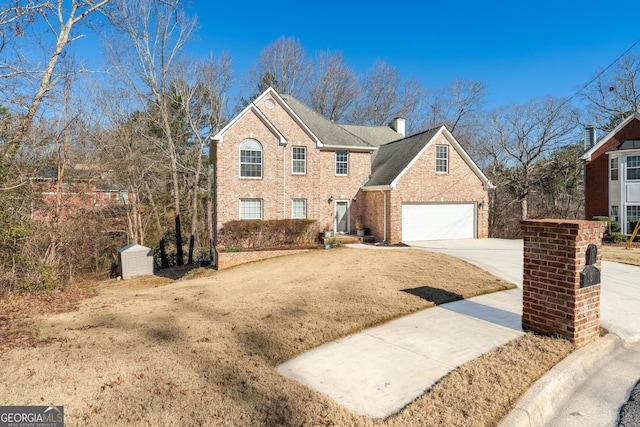 front facade featuring a garage and a front yard