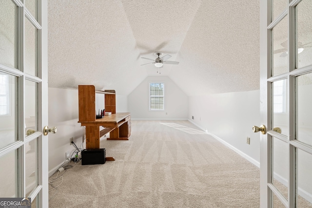 bonus room with ceiling fan, a textured ceiling, carpet floors, and vaulted ceiling