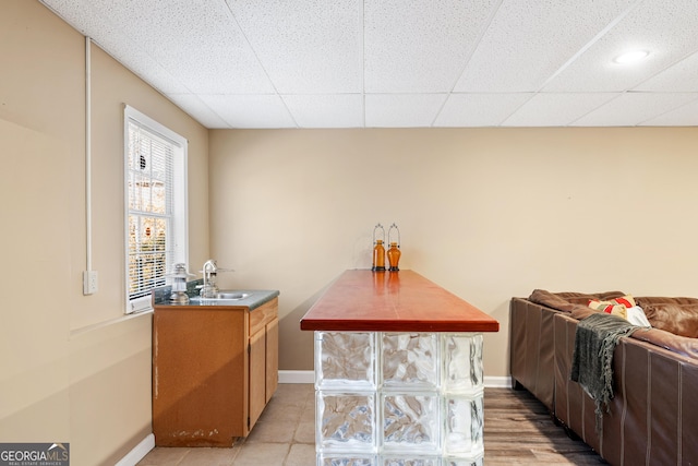 bar with a drop ceiling and sink