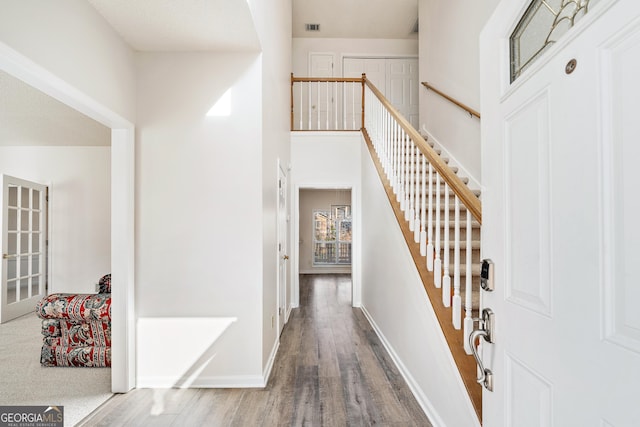 foyer entrance with hardwood / wood-style flooring