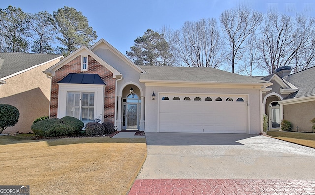 view of front of property with a garage and a front lawn