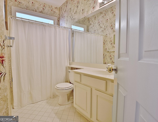 bathroom with walk in shower, vanity, toilet, and tile patterned flooring