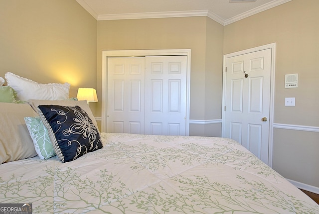 bedroom with crown molding and a closet