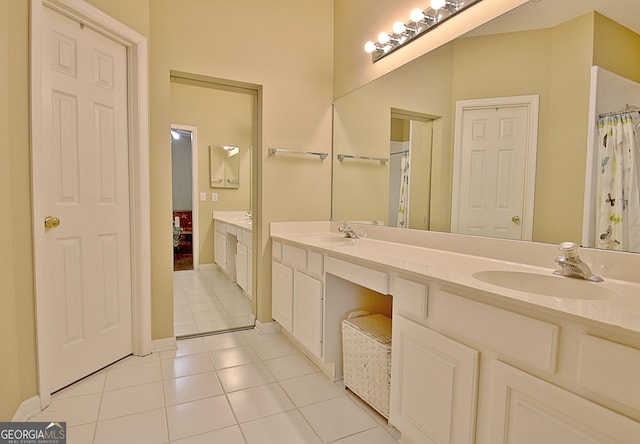 bathroom featuring tile patterned flooring and vanity