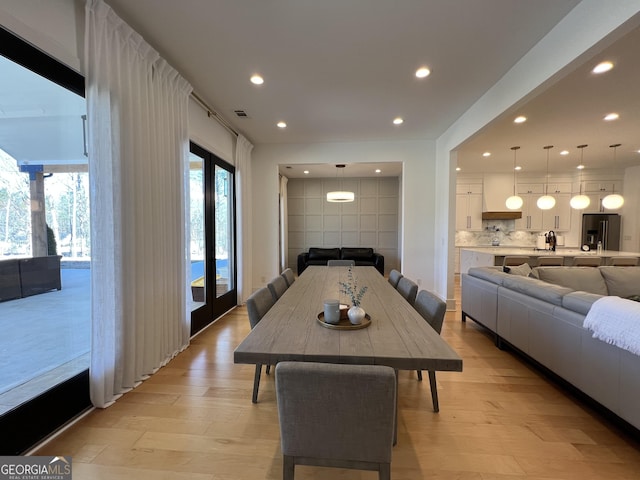 dining area with light wood-type flooring