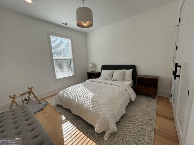 bedroom featuring light hardwood / wood-style floors