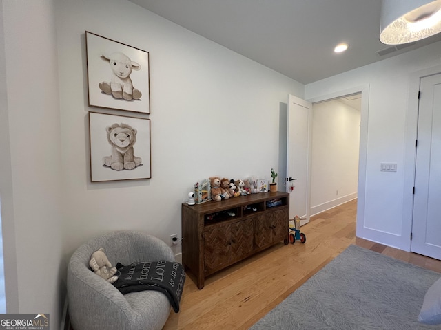 sitting room featuring hardwood / wood-style floors