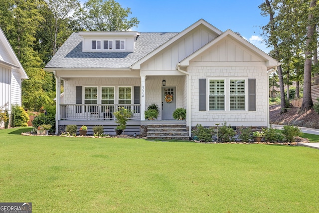 view of front of house featuring a front yard and a porch