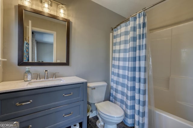 full bathroom with vanity, shower / tub combo with curtain, and toilet