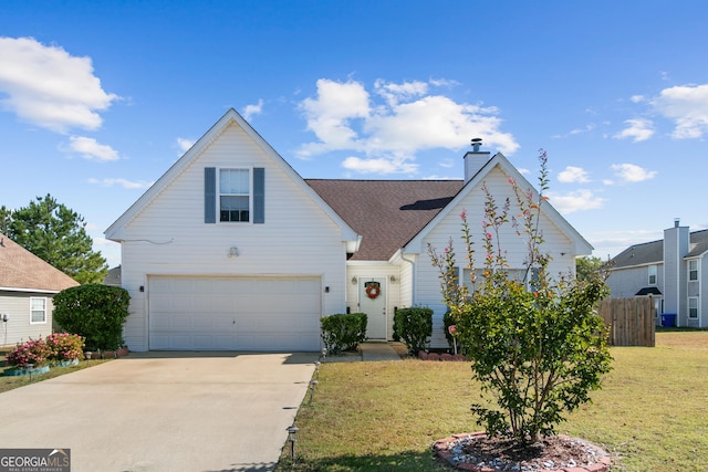 view of front of home with a front yard and a garage