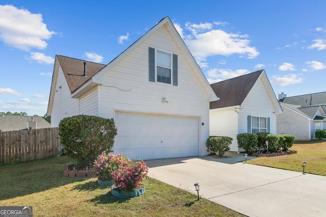 view of front facade with a front lawn and a garage