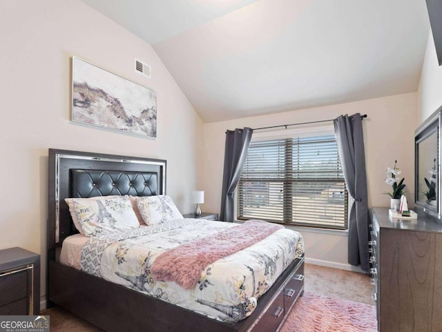 carpeted bedroom featuring vaulted ceiling