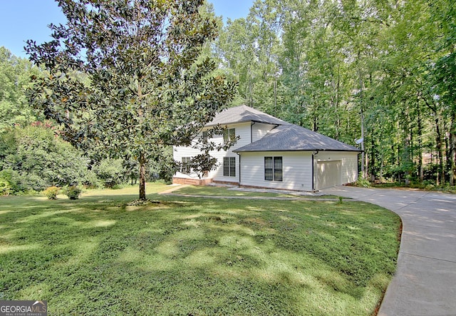 exterior space featuring a front yard and a garage