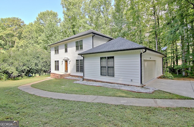 view of front of house featuring a garage and a front yard