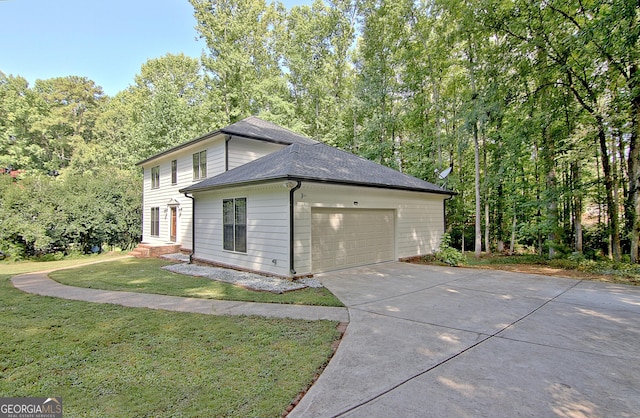 view of property exterior with a garage and a lawn