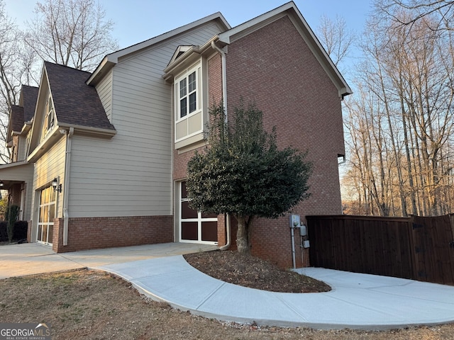 view of property exterior featuring a garage