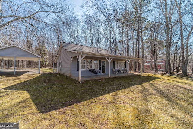 exterior space with a front lawn and a patio