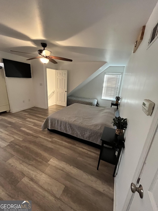 bedroom with hardwood / wood-style floors and ceiling fan