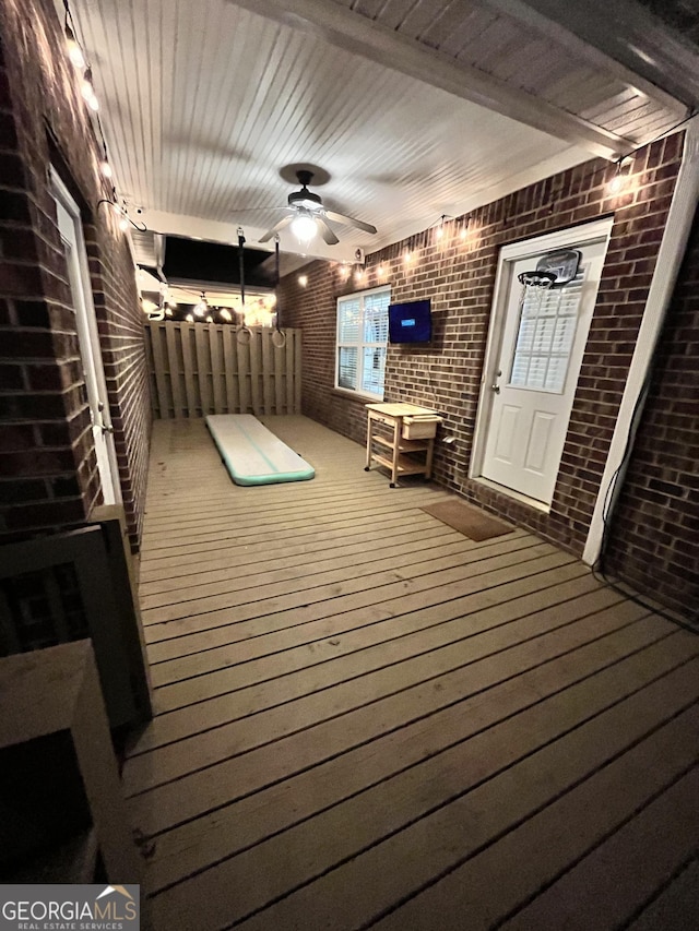 wooden deck featuring ceiling fan