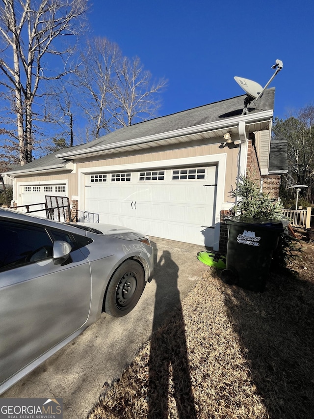 view of side of property featuring a garage