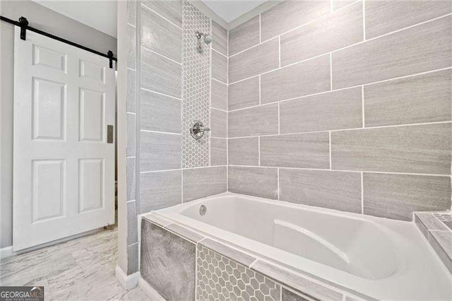 bathroom featuring tiled shower / bath