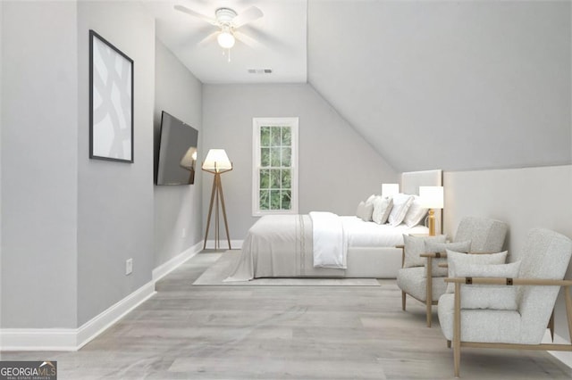 bedroom featuring ceiling fan, light hardwood / wood-style floors, and vaulted ceiling