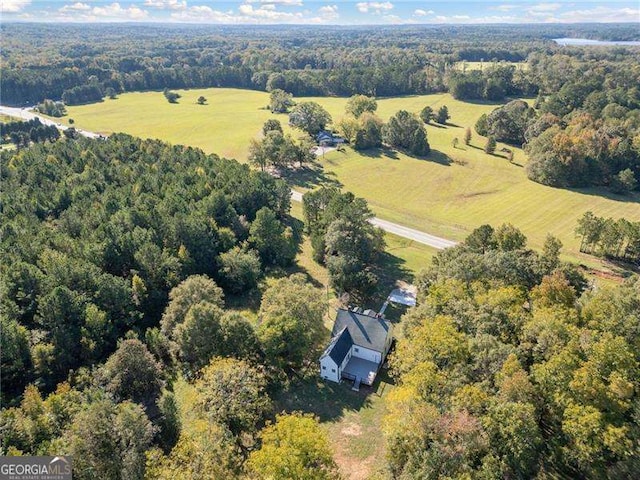 birds eye view of property with a rural view