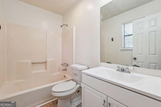 full bathroom featuring tub / shower combination, a textured ceiling, toilet, and vanity