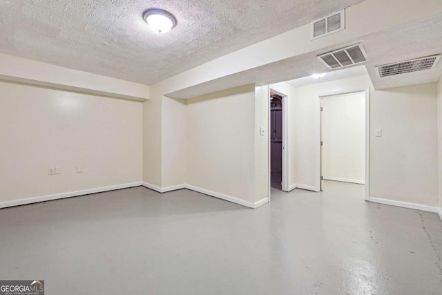 basement with a textured ceiling