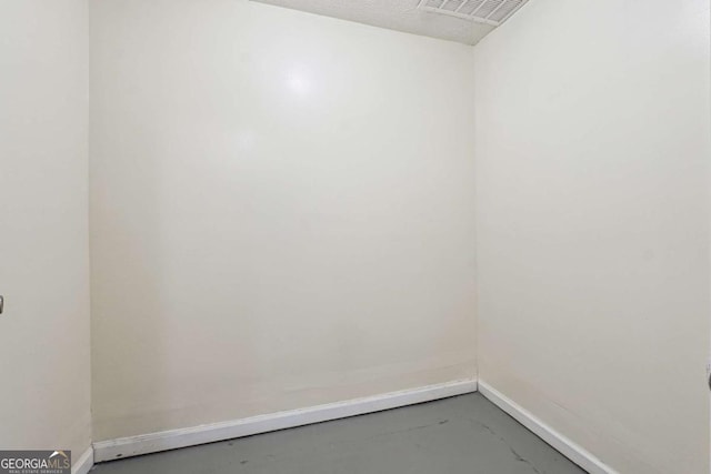 empty room featuring concrete floors