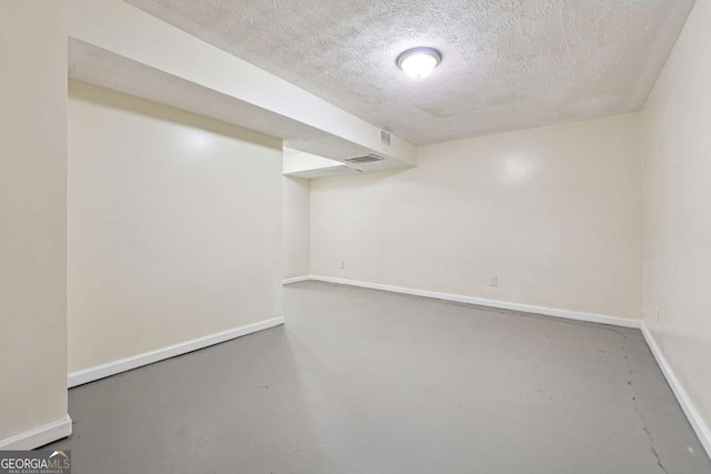 basement with a textured ceiling