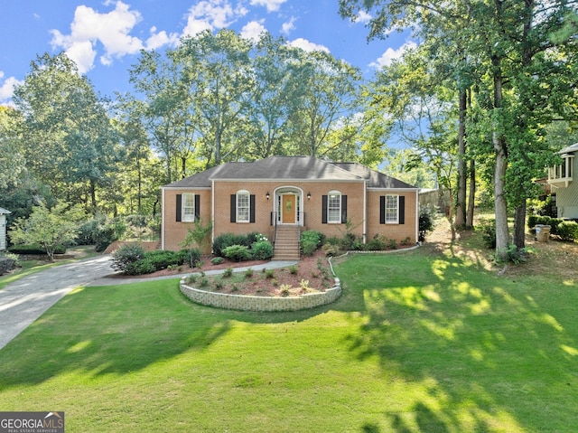 single story home featuring a front yard