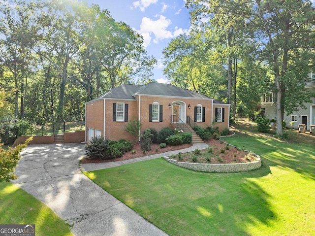 view of front of property with a garage and a front yard