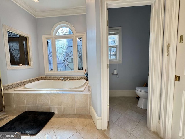 bathroom with crown molding, tile patterned flooring, toilet, and a relaxing tiled tub