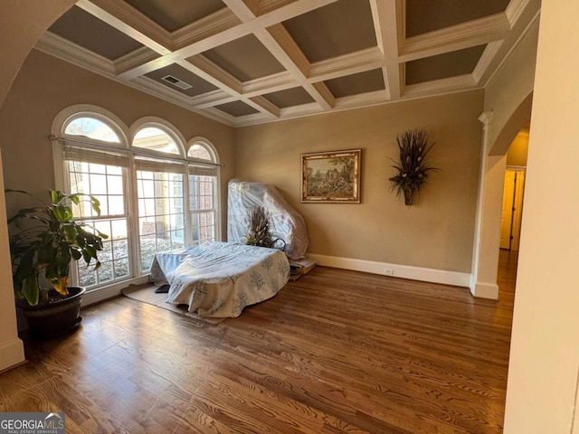 sitting room featuring dark hardwood / wood-style floors, beamed ceiling, crown molding, and coffered ceiling