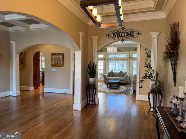 entryway with ornate columns, crown molding, and coffered ceiling