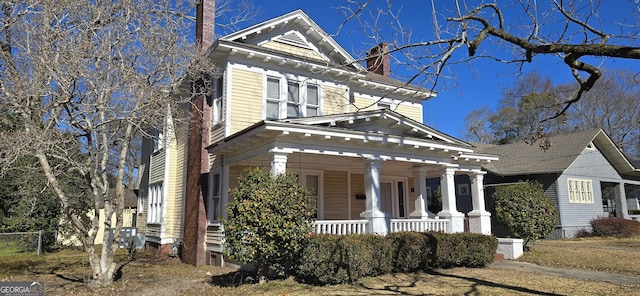 neoclassical / greek revival house with a porch