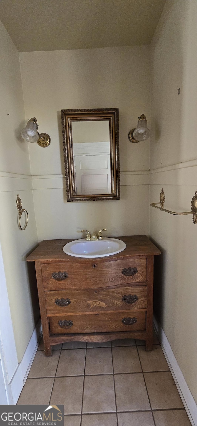 bathroom with vanity and tile patterned flooring