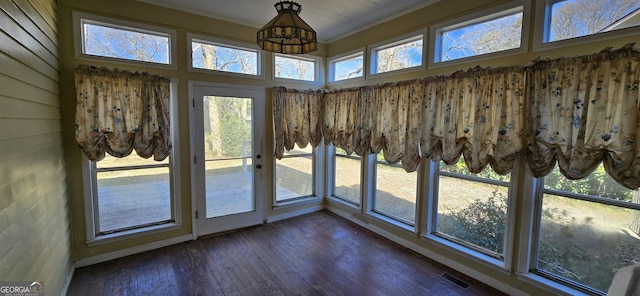 unfurnished sunroom with plenty of natural light