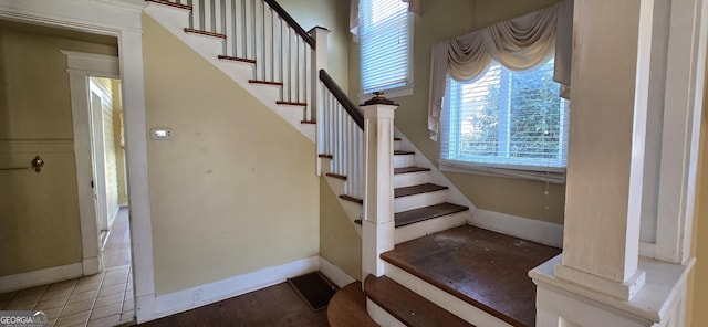 stairs with tile patterned flooring