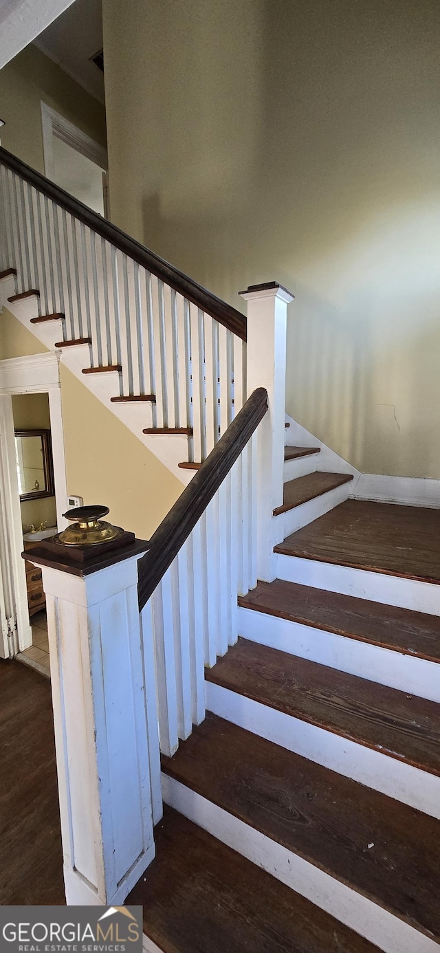 stairway with wood-type flooring