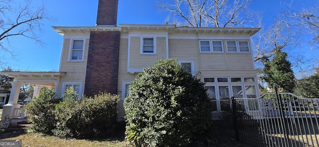 back of house with a sunroom